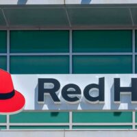 Red Hat logo and sign on open-source software company office in Silicon Valley. Red Hat has its corporate headquarters in Raleigh, North Carolina - Sunnyvale, California, USA