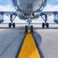 shutterstock 637037008 underside of jet aircraft and jet turbines on runway