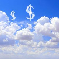 Cloud costs. US dollar signs floating above clouds in the sky. 2166686133