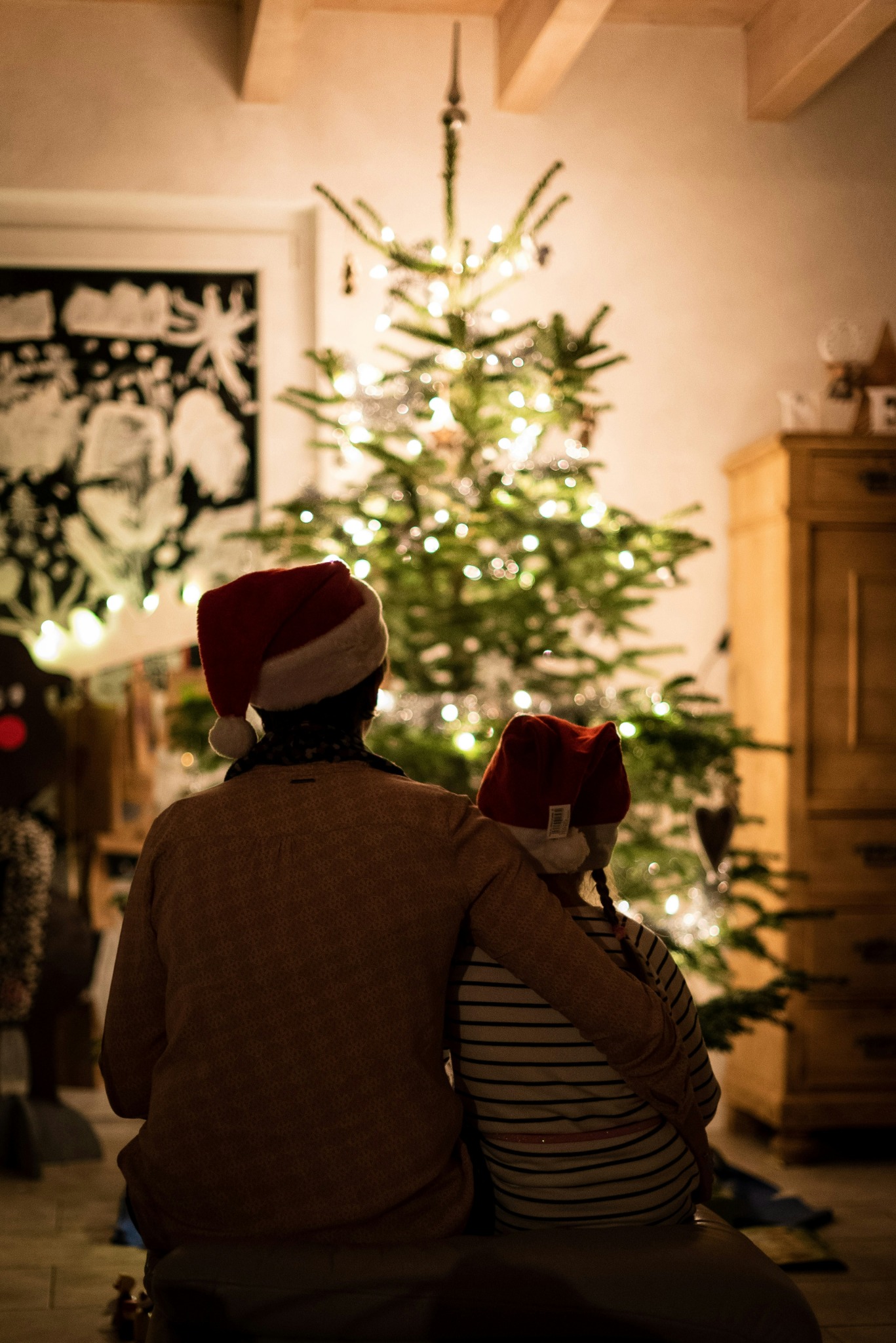 Family enjoying christmas tree