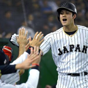 Shohei ohtani high fives japan jersey