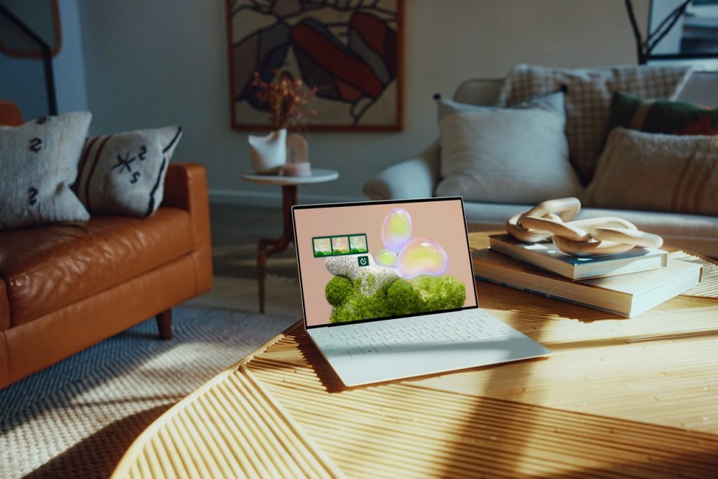 Dell XPS 13 open on a table in a living room