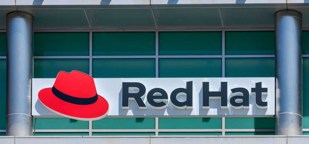 Red Hat logo and sign on open-source software company office in Silicon Valley. Red Hat has its corporate headquarters in Raleigh, North Carolina - Sunnyvale, California, USA